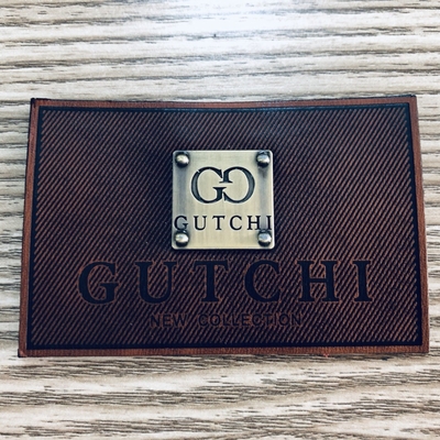 Freundliches kundenspezifisches Lederflicken Eco glänzendes Metall Logo For Cowboy Clothing